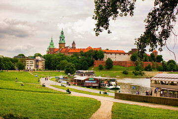 Landscape of a Wawel castle next to vistula river against dramatic cloud located in Krakow city...