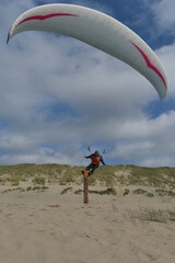 Paragliding at the beach of Katwijk aan Zee. Paraglider's making use of updraft of the dunes to stay in the air 