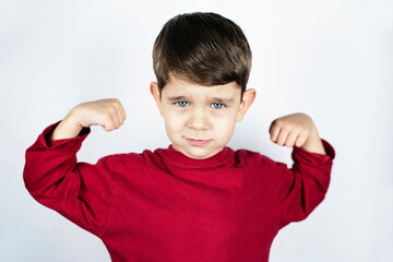 The portrait of a young boy who shows how strong he is, the boy needs to be praised, encouraged, to...