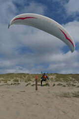 Paragliding at the beach of Katwijk aan Zee. Paraglider's making use of updraft of the dunes to stay in the air 
