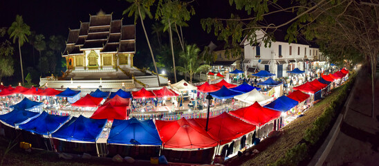 Fototapeta na wymiar Luang Prabang Night Market and Haw Pha Bang temple Panorama