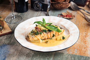 Appetizing gourmet salmon steak with creamy sauce