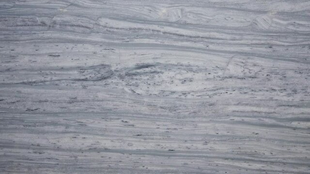 Surface Of A Polished Blueish Grey Marble Texture. Abstract Statuarietto Marble Background.  - panning shot