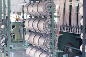 mechanical equipment at a garment factory. thread manufacturing tools.