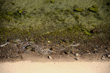 Little beach with stones in the sea