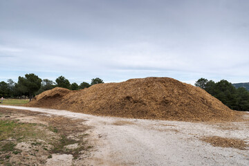 Pile of sawdust on a dirt road. Photo taken in Morazarzal, Madrid, Spain