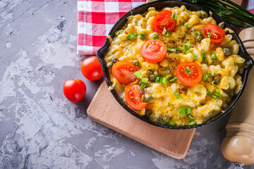 delicious pasta and cheese casserole in a cast iron skillet