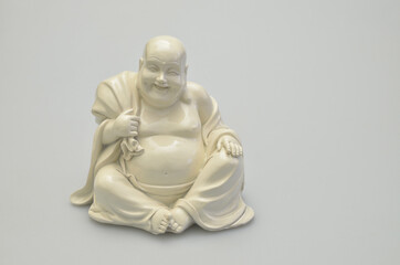 Laughing white Buddha on White