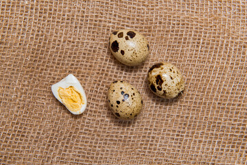 Food: group of quail eggs isolated on burlap