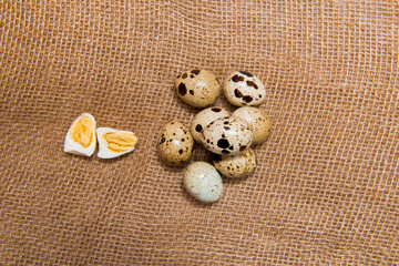 Food: group of quail eggs isolated on burlap