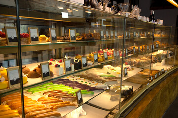 wooden table with bakery shop or coffee cafe blurred background