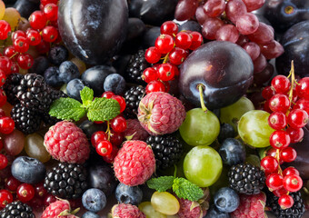 Background of fresh fruits and berries. Mix berries and fruits. Top view. Background berries and fruits.
