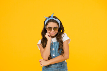 pin up kid. happy childrens day. cheerful vintage girl on yellow background. little beauty at hairdresser. love her retro fashion style. summer vacation. summer shopping sales