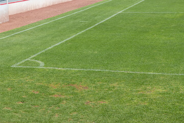 corner of a grass soccer field with white lines