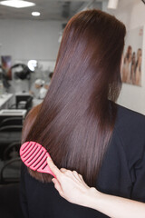 Beautiful Slavic hair on the model after care and restoration procedures in a beauty salon