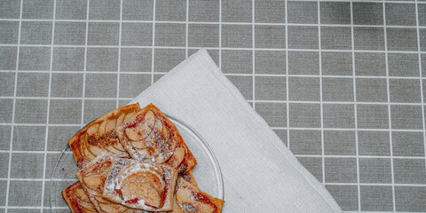 puff pastry puffs with Apple, cinnamon and powdered sugar