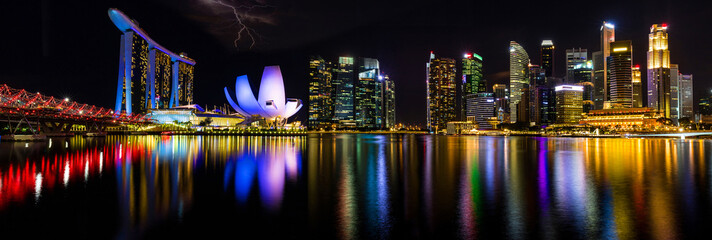 Cityscape of Singapore at night. Marina Bay is a bay located in the Central Area of Singapore , Panorama image concept.