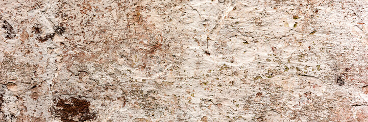 Texture of a concrete wall with cracks and scratches which can be used as a background