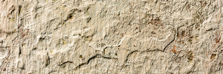 Texture of a concrete wall with cracks and scratches which can be used as a background