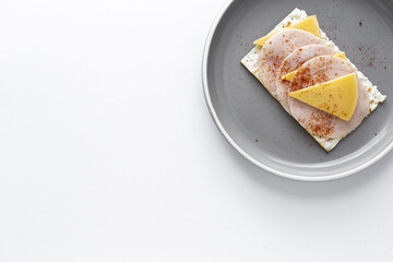 Salty crackers with sausage chicken, cheese and paprika from above