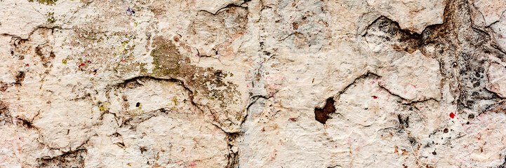 Texture of a concrete wall with cracks and scratches which can be used as a background