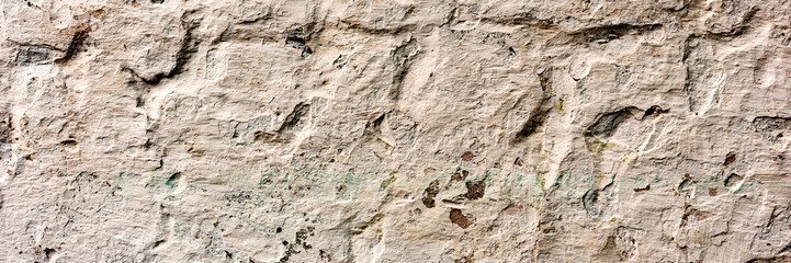 Texture of a concrete wall with cracks and scratches which can be used as a background