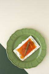 Salty crackers with salmon and cheese from above