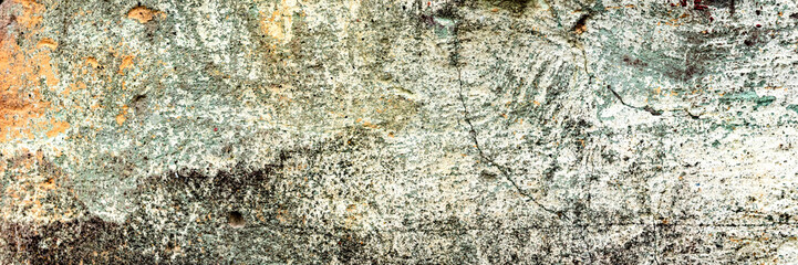 Texture of a concrete wall with cracks and scratches which can be used as a background