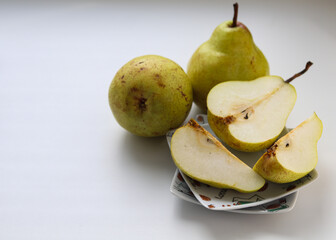 ripe juicy pears on a white background close up