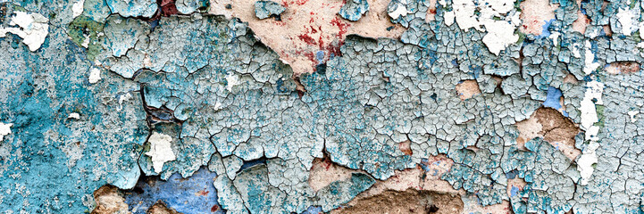 Texture of a concrete wall with cracks and scratches which can be used as a background