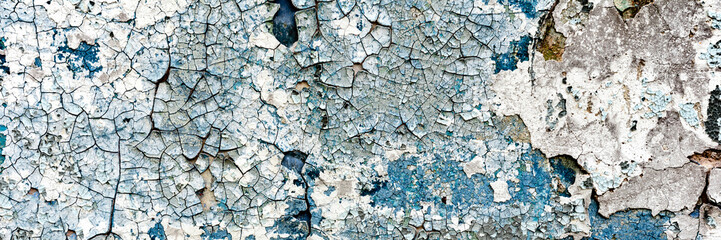 Texture of a concrete wall with cracks and scratches which can be used as a background