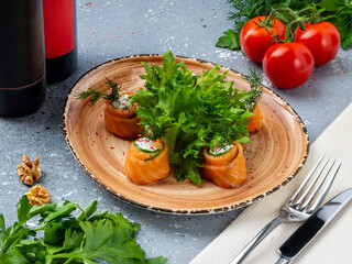 Salmon rolls with cheese, salad and mockup wine bottles