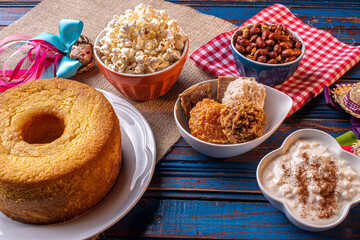 June party. Typical sweets from festa junina. Cornmeal cake, popcorn, hominy, paçoca, cocada, pumpkin jam, and peanuts.
