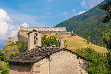 Fototapeta na wymiar Exilles, Italy - August 21, 2019: The Exilles Fort is a fortified complex in the Susa Valley, Metropolitan City of Turin, Piedmont, northern Italy