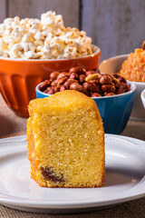 June party. Typical sweets from festa junina. Cornmeal cake, popcorn, hominy, paçoca, cocada, pumpkin jam, and peanuts