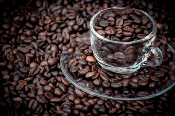 coffee beans in a cup and around the cup