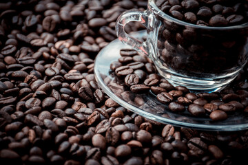 coffee beans in a cup and around the cup