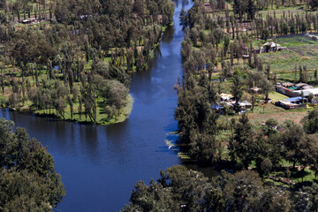 Aerial view of Mexico City with channels for tourism and transportation to agricultural chinampas in Xochimilco