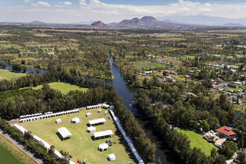 Aerial view of the old Cuemanco channel located in Xochimilco, Mexico City, with the Catarina mountains in the back