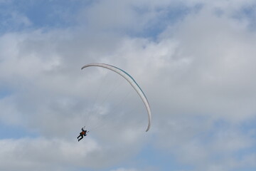 Paragliding at the beach of Katwijk aan Zee. Paraglider's making use of updraft of the dunes to stay in the air