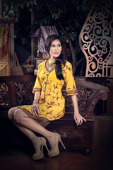 Fototapeta premium beautiful woman wearing an elegant batik dress, Batik is a fabric that is painted using canting and liquid wax night so as to form paintings of high artistic value from Indonesia