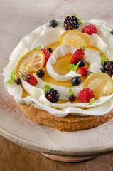 Lemon Meringue pie with berries
Swirling meringue among fruits on top of pie
