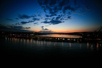 Fototapeta na wymiar bridge view. bridge lights reflections in the sea. sunset