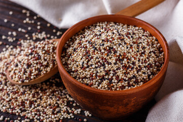 mix of quinoa grains on dark wooden rustic background
