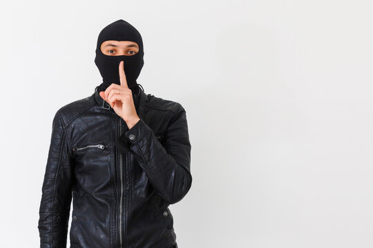an burglar wearing a ski mask