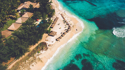 Top view aerial photo from flying drone of a beautiful view on a Asian island with luxury hotels...