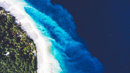 Top view aerial drone photo of unspoiled, deserted, powder-white sandy seashore with crystalline water. One of the most beautiful beaches in the world for travel website or journey blog background