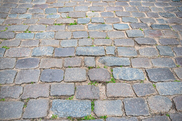 Stone pavement or road in old town as background, vintage cobblestone 