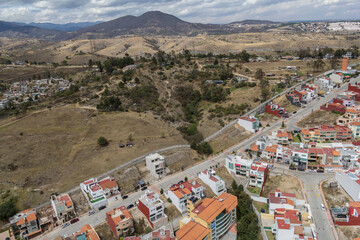 Aerial view of the limit of the urban and rural area of the outer part of Mexico City, showing how fast this city is growing and expanding