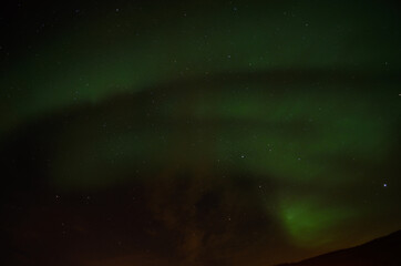 vibrant aurora borealis, northern light on the arctic night sky, northern Norway